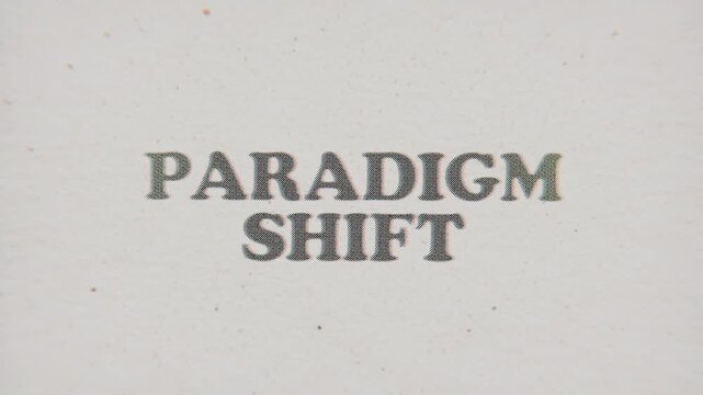 CMYK Halftone Text Paradigm Shift Printed on Changing Paper with Vintage Stop Motion Effect.