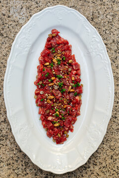 Beef tartare with pine nuts and herbs