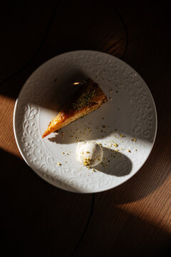Delicious dessert served on a decorative plate with a dollop of cream