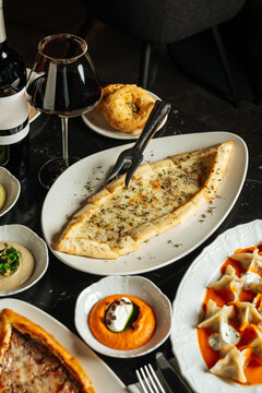 Cheese pide with wine and Turkish meze