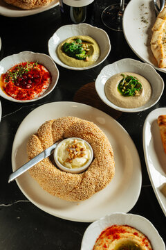 Simit with butter and assorted Middle Eastern dips