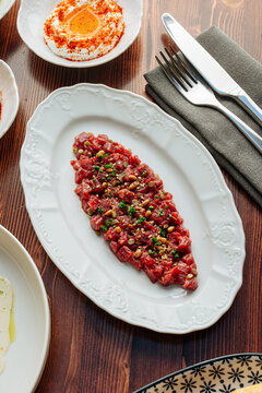 Beef tartare with pine nuts and herbs
