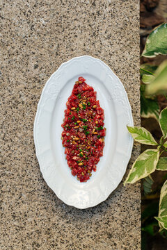 Beef tartare with herbs and pine nuts