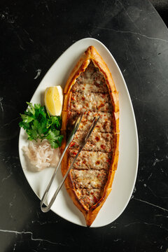 Turkish pide with minced meat and cheese