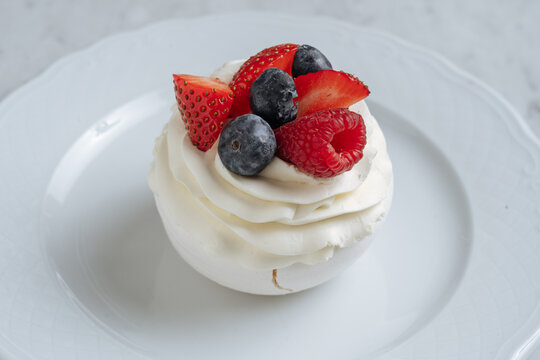 Mini Pavlova with Whipped Cream and Berries