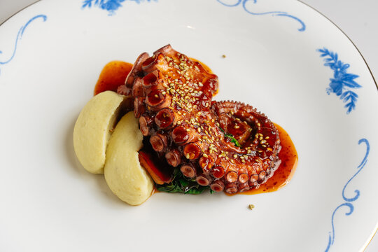 Octopus tentacle with mashed potatoes and sesame glaze