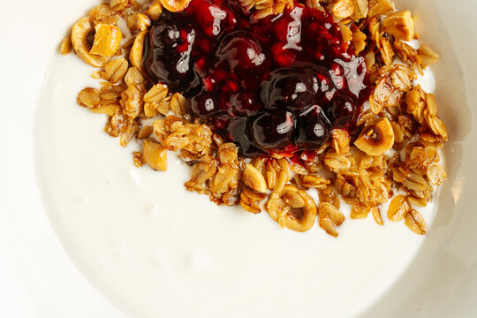 Yogurt with granola and berry jam