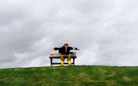 Chinese boys playing on the grassy slopes of the plateau