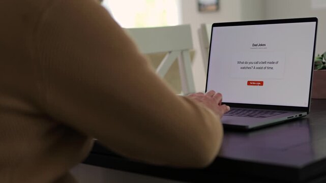 Middle Aged Man Testing Classic Dad Joke Generator Web Application - Dad Jokes On Demand Comic Relief Concept