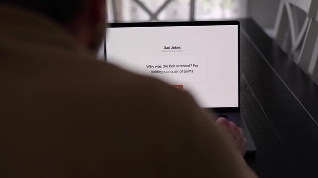 Middle Aged Man Testing Classic Dad Joke Generator Web Application - Dad Jokes On Demand Comic Relief Concept