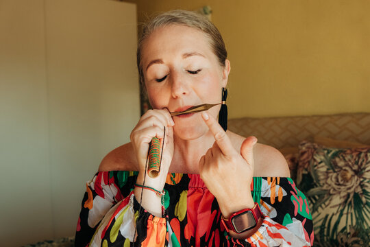 Closeup of a female musician playing jew's harp