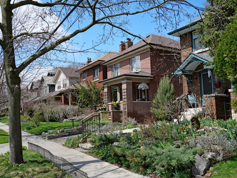 residential street with traditional brick detached houses