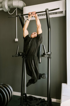 A man is working out in the gym.