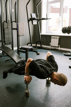A man is working out in the gym.