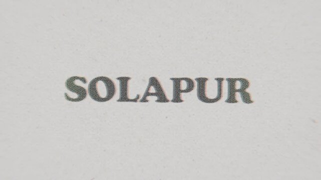 CMYK Halftone Text Solapur Printed on Changing Paper with Vintage Stop Motion Effect.