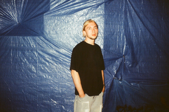 Urban Portrait Against Tarp