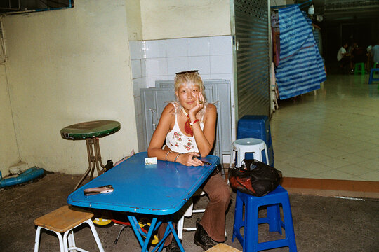 Waiting at a Street Table Before Eating.