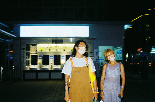 Support and Care Outside a City Hospital at Night