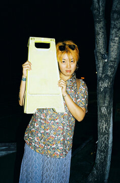 Holding a Caution Sign at Night