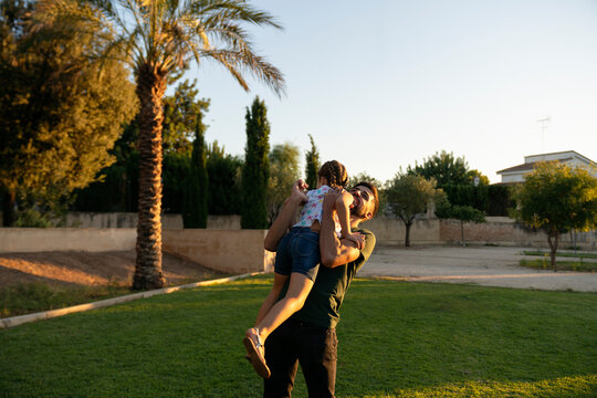 Dad hugging his daughter