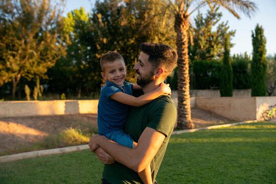 Dad hugging his son
