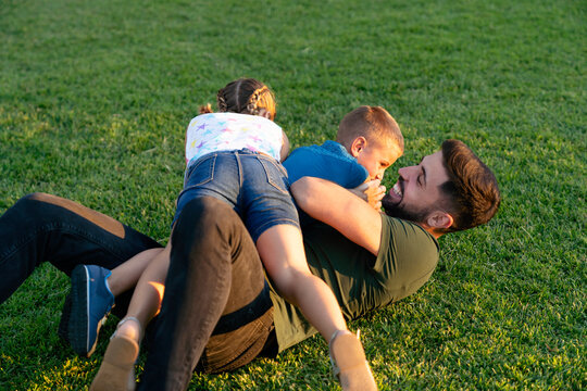Children having fun with their father
