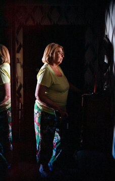 Woman is looking in the mirror