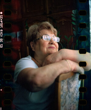 Woman is looking at the window
