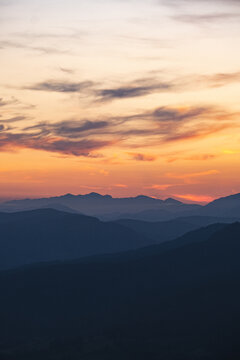 Dramatic mountain landscape with silhouetted hills 