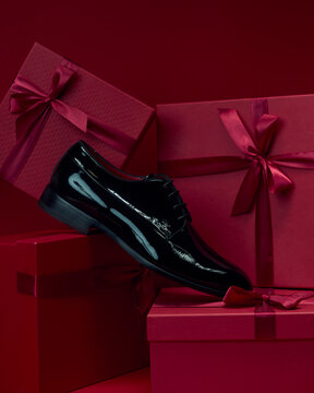 Black Patent Leather Dress Shoes on Red Gift Boxes