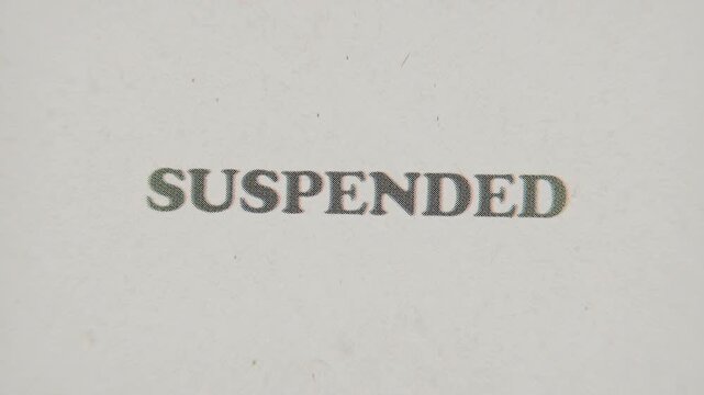 CMYK Halftone Text Suspended Printed on Changing Paper with Vintage Stop Motion Effect.