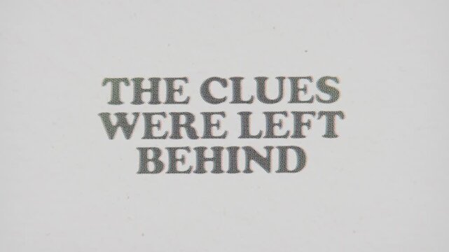 CMYK Halftone Text The Clues Were Left Behind Printed on Changing Paper with Vintage Stop Motion Effect.