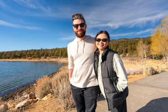Couple strolls outside 
