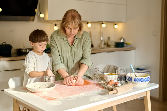 Grandmother Baking with Grandchild at Home