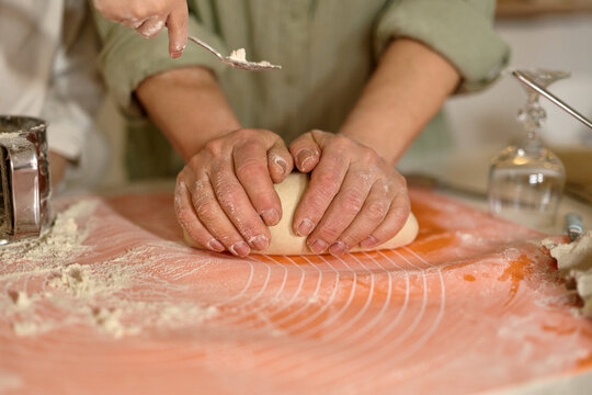 Hands Kneading Dough at Home