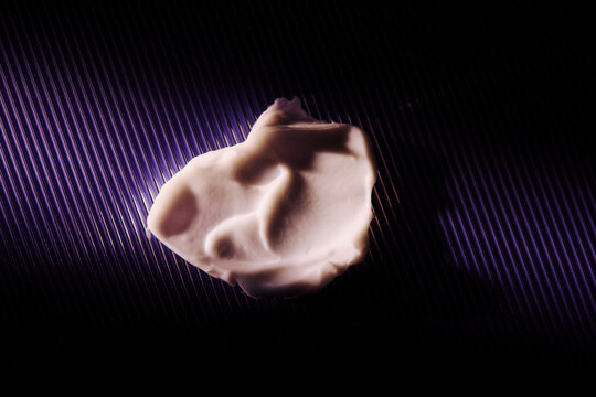 Fresh skincare lotion swipe on bold purple