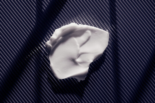 skincare lotion smear over grey background
