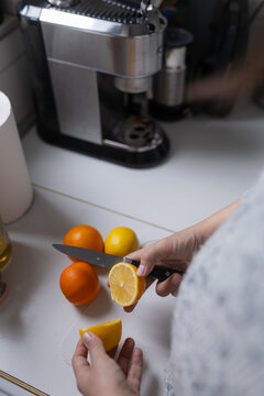 Anonymous Person Cutting Fruits
