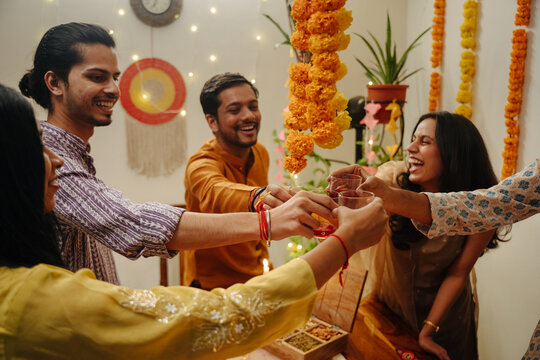 Friends Celebrate Diwali Festival With Drinks and Decorations at Home