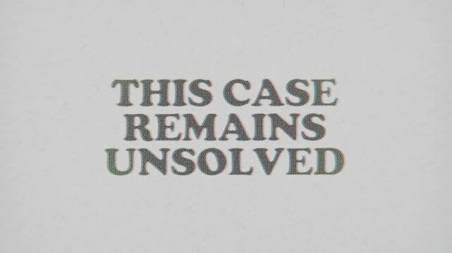 CMYK Halftone Text This Case Remains Unsolved Printed on Changing Paper with Vintage Stop Motion Effect.