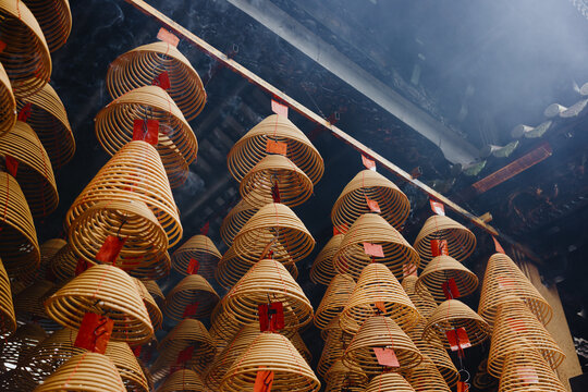 Rows of Hanging Spiral Incense Coils in Temple