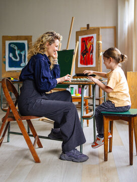 Mother And Child Playing Board Game