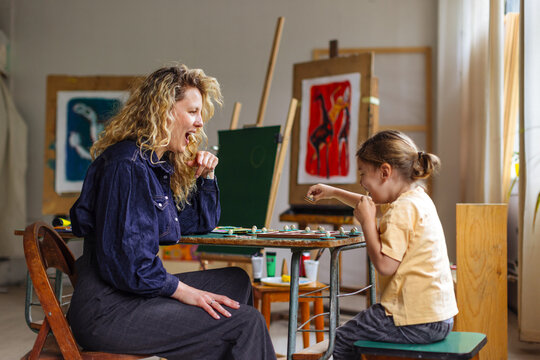 Mother And Child Laughing At Art Studio