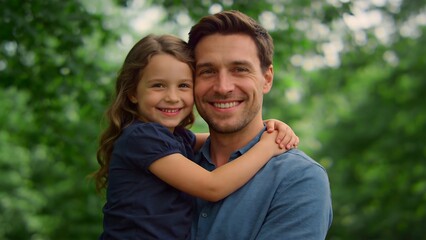 Obraz premium man and girl smiling outdoors