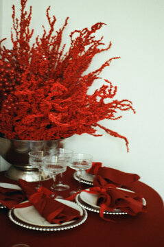 Festive table setup with vibrant red details