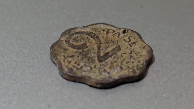 This 2 Paise coin from India was minted in aluminium between 1965 and 1981. It features a unique scalloped edge, weighs 1 gram, and measures 20 mm. These coins are now popular vintage collectibles.