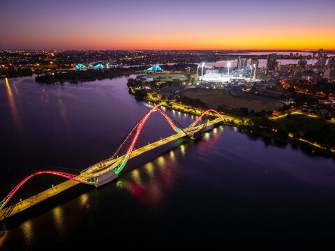 Beautiful bridge and city stadium just after sunset.