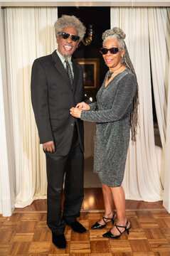 Couple Dressed in Formal Wear Poses for a Photo at an Event