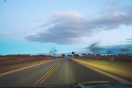 Road travels during sunset hour
