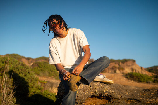Beautiful black woman getting dressed 